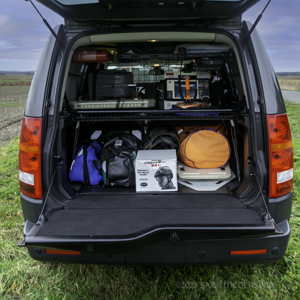 Rear of Land Rover packed with equipment